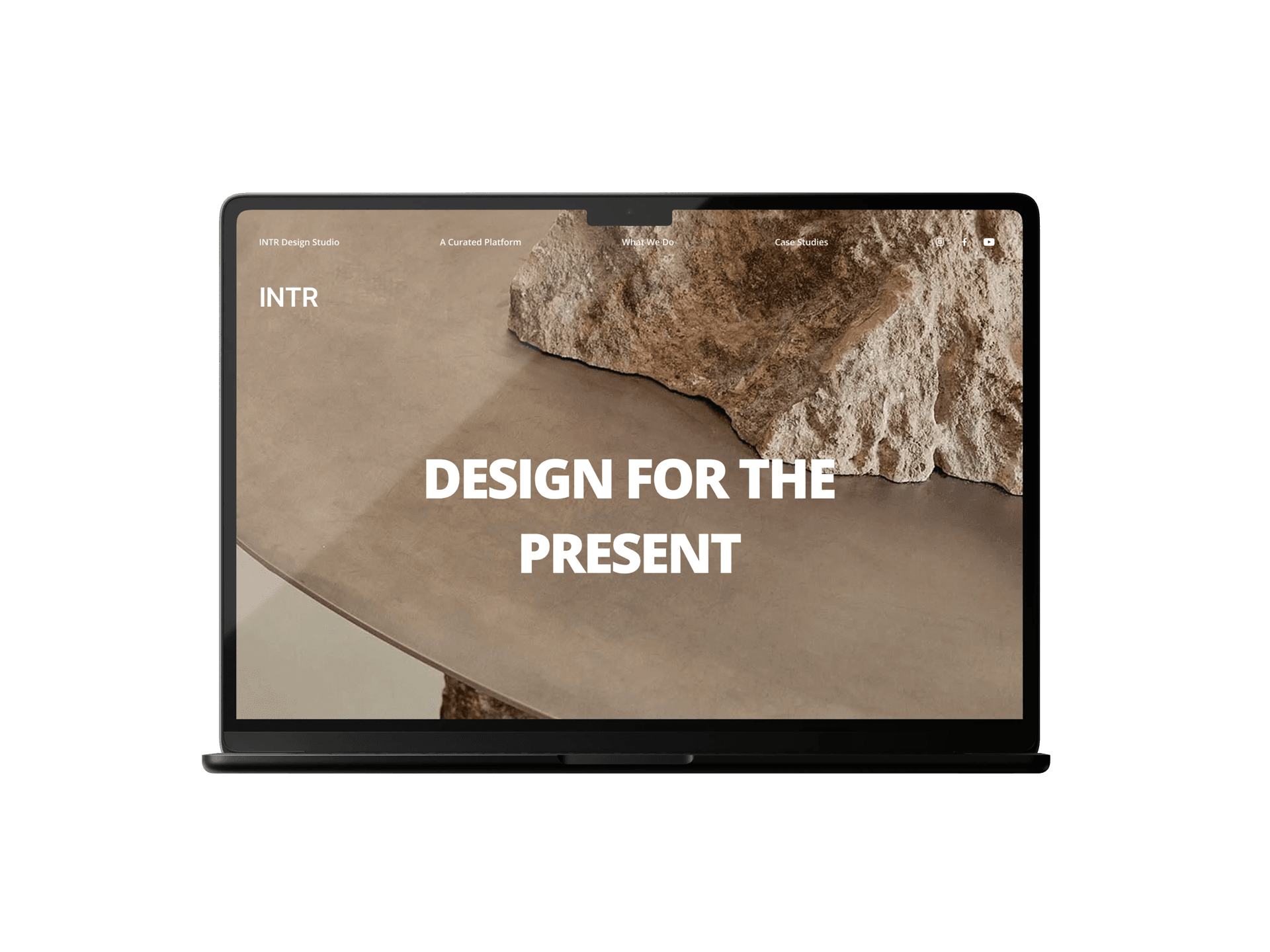 MacBook mockup of the INTR homepage — Design for the Present