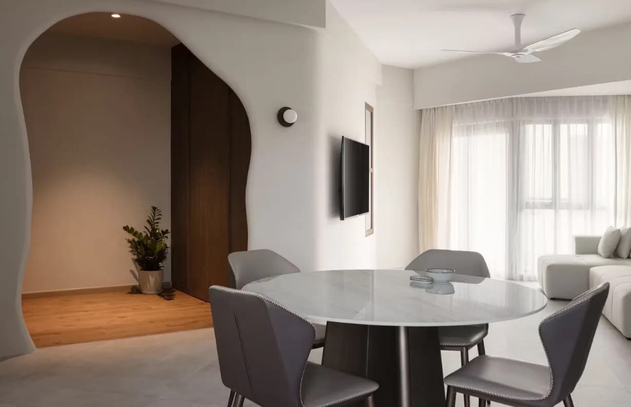 Dining space with an arched doorway